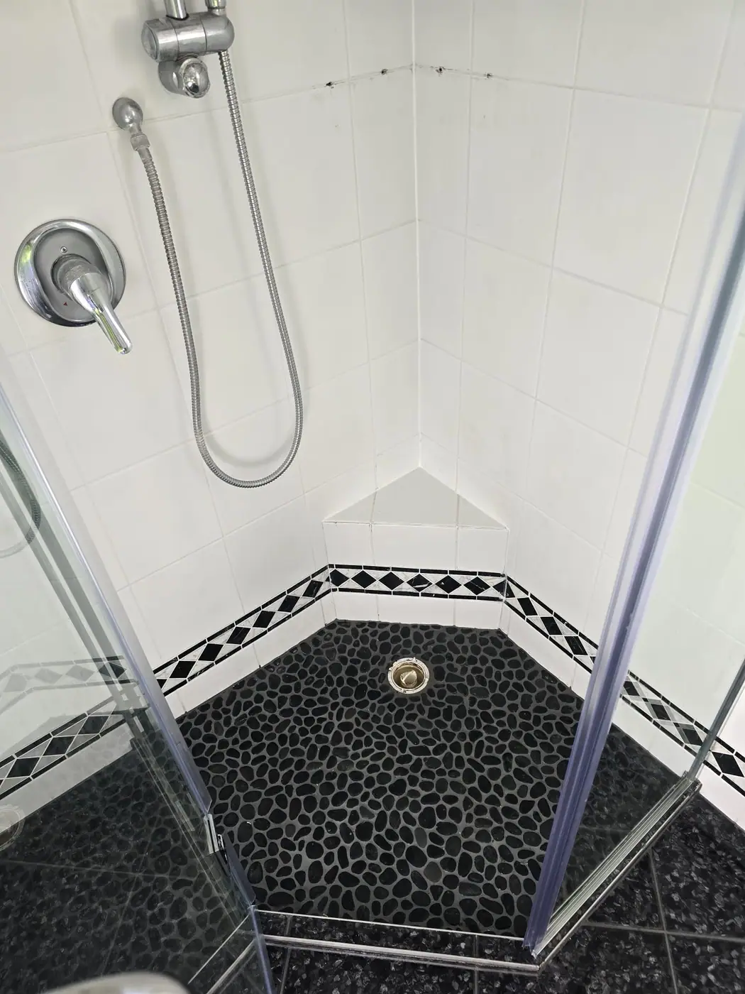 Pebble shower floor after restoration