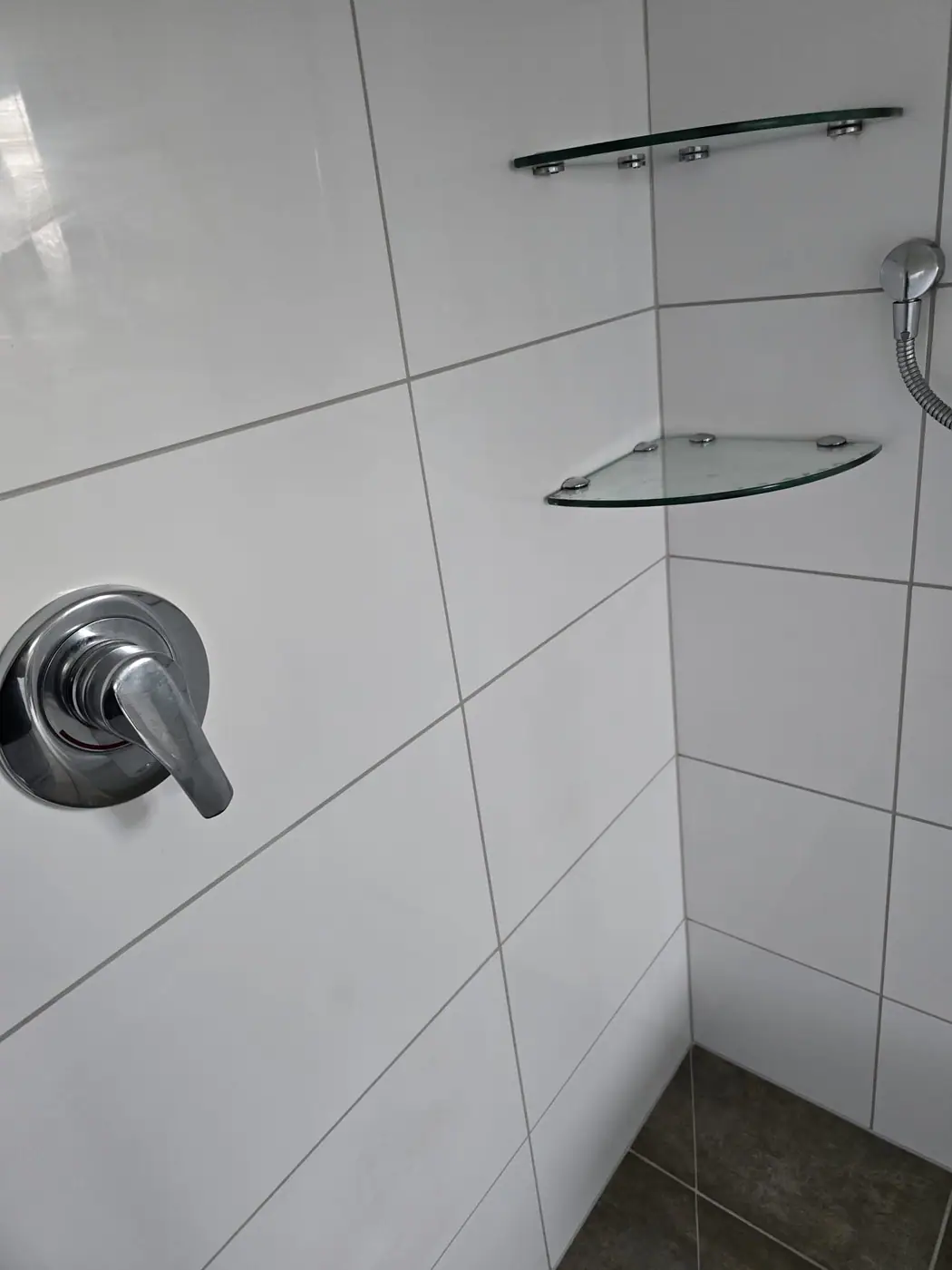 Leaky shower tile repair and regrouting result